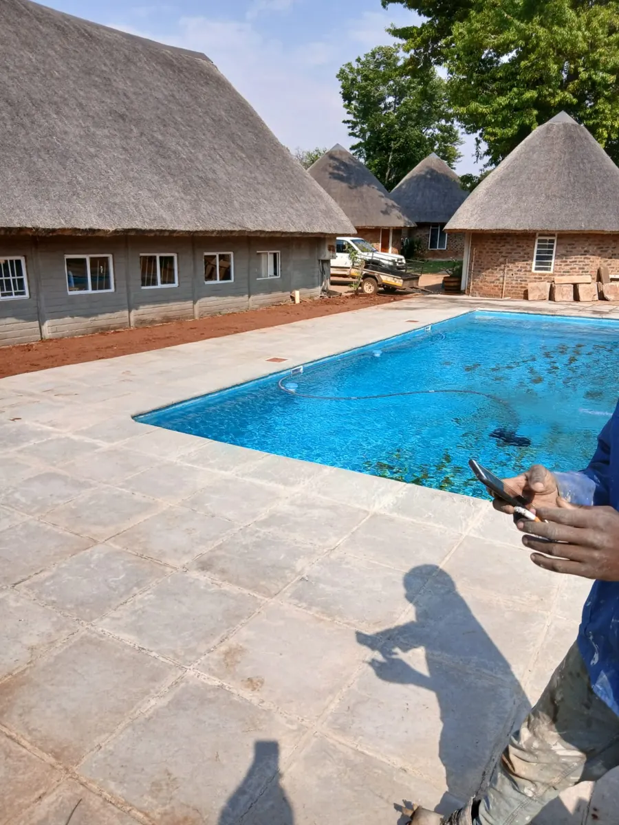Pool deck paving at a thatch lodge